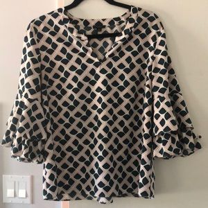 This Ann Taylor M blouse is light pink and green and in great condition!